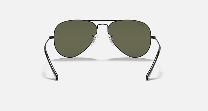 Aviator sunglasses with gold frame and deep green tinted lenses