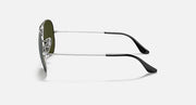 Ray-Ban aviator sunglasses with green lenses, silver frame, and black temple tips