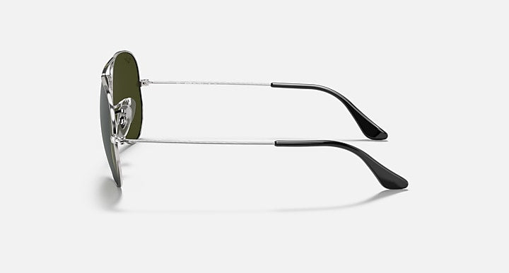 Ray-Ban aviator sunglasses with green lenses, silver frame, and black temple tips