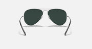 Ray-Ban aviator sunglasses with thin metal frame and deep green tinted lenses.