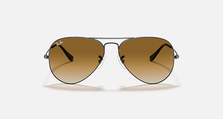 Gold-tone aviator sunglasses with brown gradient lenses and metal frame