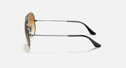 Silver aviator sunglasses with dark tinted lenses and black curved temple tips
