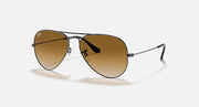 Black aviator sunglasses with dark brown lenses and slim metal frame arms