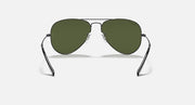 Ray-Ban aviator sunglasses with thin metal frame and olive green tinted lenses.
