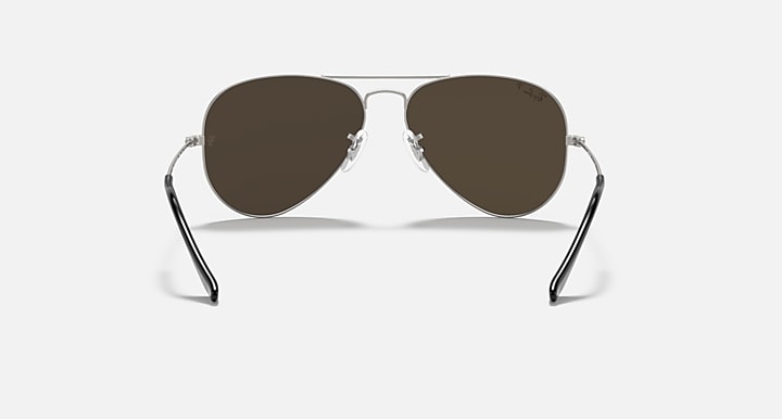 Ray-Ban aviator sunglasses with thin metal frame and dark gray tinted lenses.