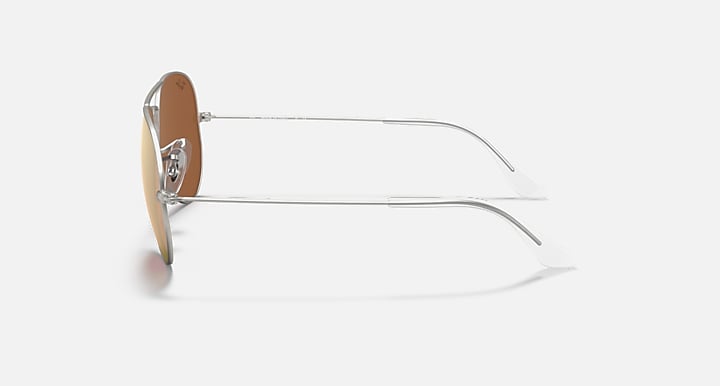 Ray-Ban Aviator sunglasses with silver frame and amber-tinted lenses