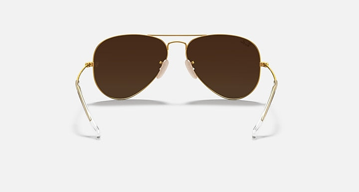 Ray-Ban aviator sunglasses with rich brown lenses and gold metal frame
