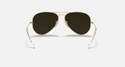 Ray-Ban aviator sunglasses with dark brown lenses and gold metal frame