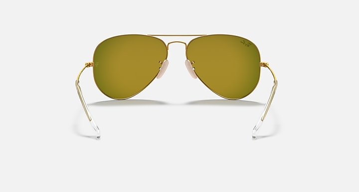 Ray-Ban aviator sunglasses with olive-yellow lenses and gold metal frame