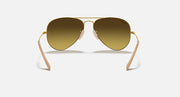 Ray-Ban aviator sunglasses with warm brown lenses and gold metal frame