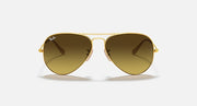 Gold aviator sunglasses with warm brown tinted lenses and metal bridge
