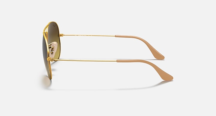 Ray-Ban Aviator RB3025 sunglasses with gold metal frame and brown temple tips