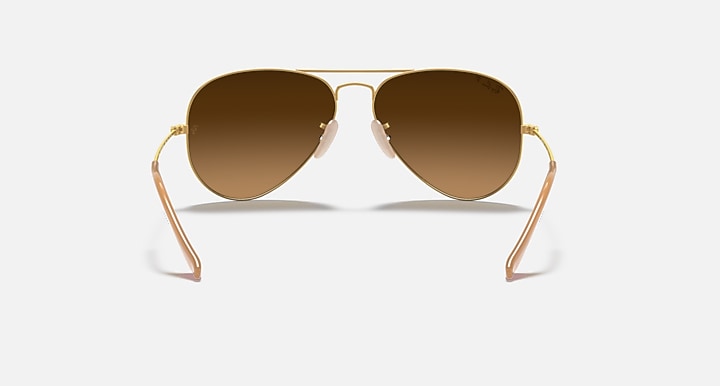 Ray-Ban aviator sunglasses with amber-brown lenses and gold metal frame