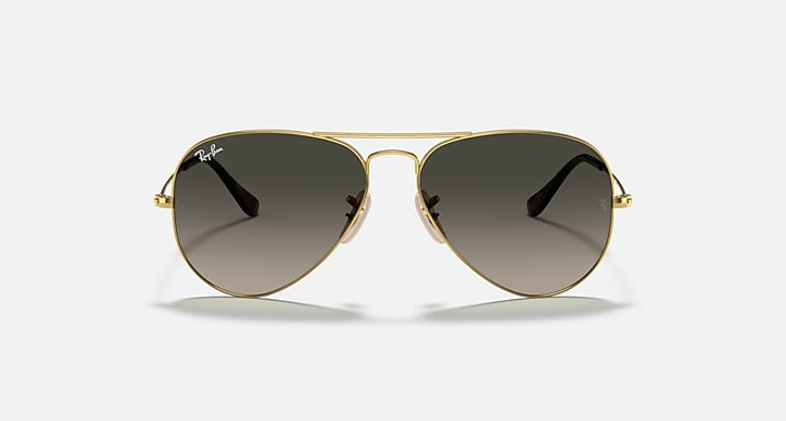 Gold aviator sunglasses with dark brown lenses and gradient finish