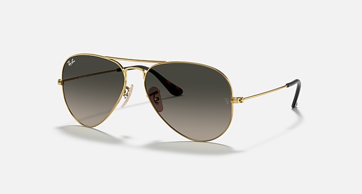 Ray-Ban aviator sunglasses with gold frame and dark brown gradient lenses