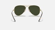 Aviator sunglasses with gold frame and dark green tinted lenses
