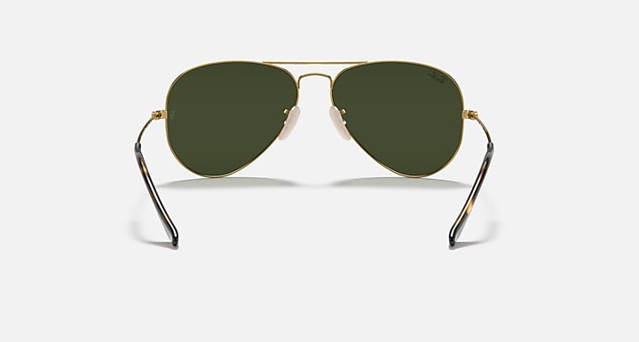 Aviator sunglasses with gold frame and dark green tinted lenses