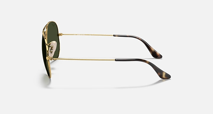 Ray-Ban aviator sunglasses with gold metal frame and dark lenses with tortoise tips