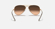 Aviator sunglasses with gold frame and brown gradient lenses
