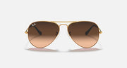 Gold aviator sunglasses with brown tinted lenses and metal bridge