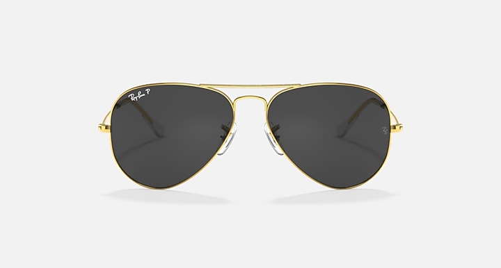 Ray-Ban aviator sunglasses with gold frame and dark black/gray tinted lenses