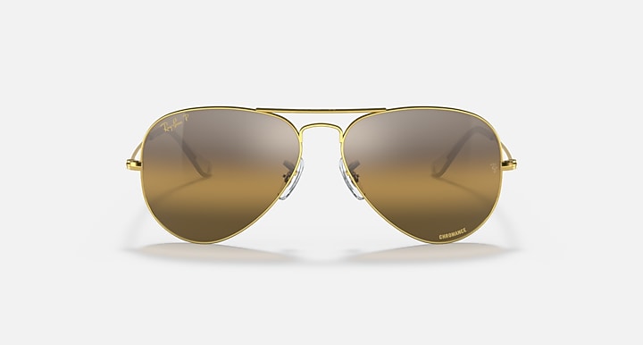 Ray-Ban aviator sunglasses with amber lenses and gold metal frame