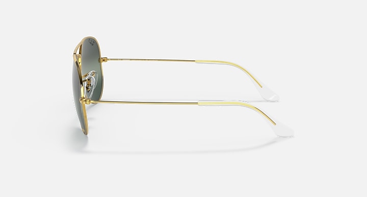 Ray-Ban aviator sunglasses with gold metal frame and clear-tint lenses