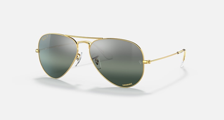 Ray-Ban aviator sunglasses with gold frame and green tinted lenses
