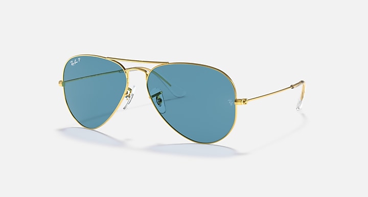 Gold aviator sunglasses with blue lenses and thin metal frame arms