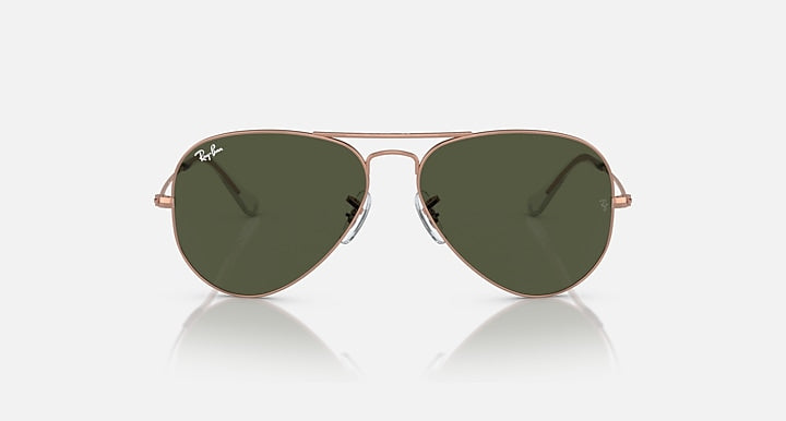 Ray-Ban aviator sunglasses with rose gold frame and dark green tinted lenses