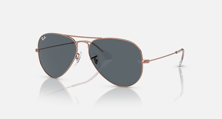 Ray-Ban aviator sunglasses with rose gold frame and dark blue lenses