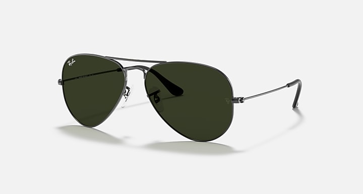 Dark frame aviator sunglasses with green lenses and slim metal frame arms