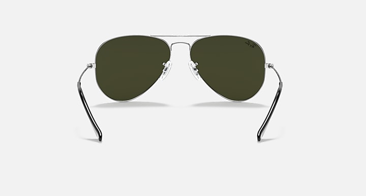 Aviator sunglasses with dark frame and deep green tinted lenses