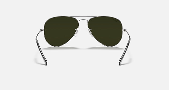 Aviator sunglasses with dark frame and dark green tinted lenses