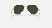 Aviator sunglasses with gold frame and dark green tinted lenses