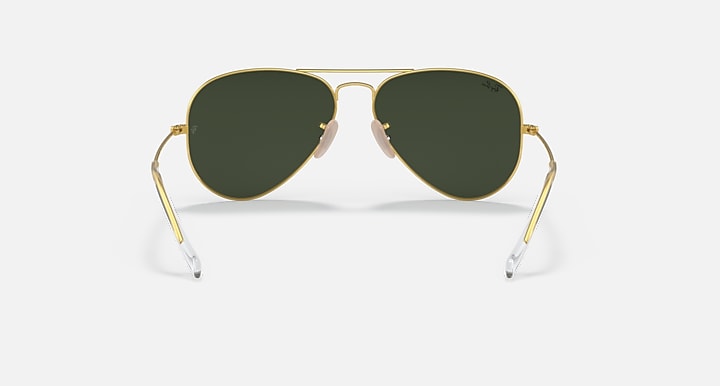 Aviator sunglasses with gold frame and dark green tinted lenses
