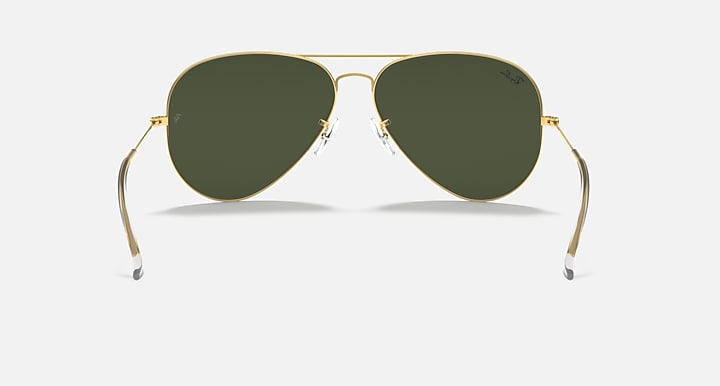 Ray-Ban aviator sunglasses with gold metal frame and dark green lenses, front view