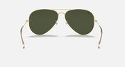 Aviator sunglasses with gold frame, dark green lenses, and curved arms