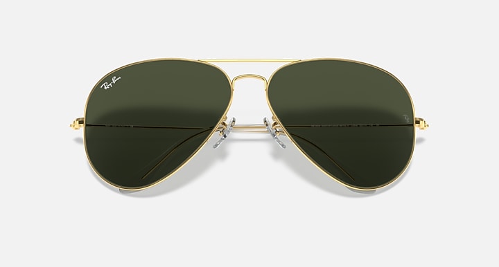 Aviator sunglasses with gold frame and dark green mirrored lenses