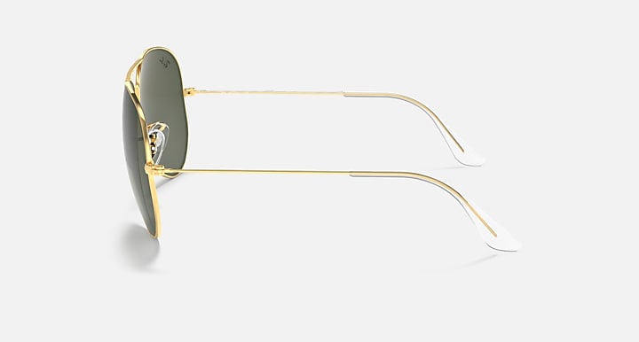 Aviator sunglasses side profile with gold frame and dark green lenses