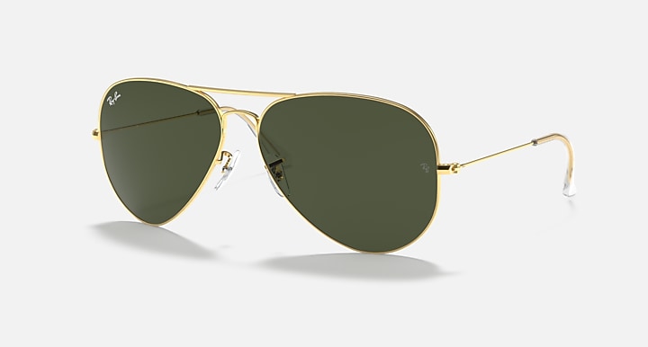 Aviator sunglasses with gold metal frame and dark green lenses