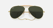 Gold frame aviator sunglasses with dark green lenses, close-up front view