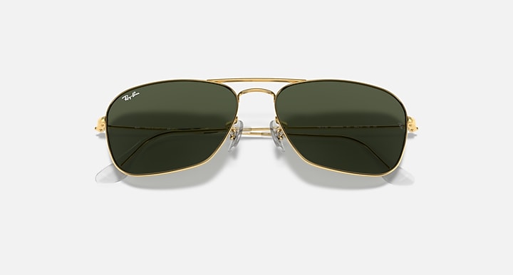 Ray-Ban Caravan sunglasses close front with dark green lenses and gold bridge
