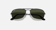 Ray-Ban aviator sunglasses with dark green lenses and gunmetal frame bridge detail