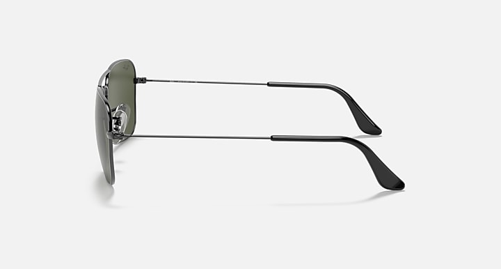 Ray-Ban aviator sunglasses side view with thin gunmetal metal frame and dark lenses