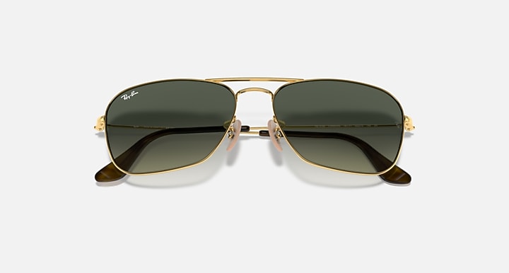 Ray-Ban Caravan RB3136 sunglasses, centered front with gold frame and dark green lenses
