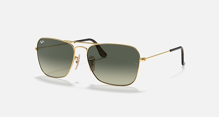 Ray-Ban Caravan RB3136 sunglasses angled, gold frame and dark green tinted lenses
