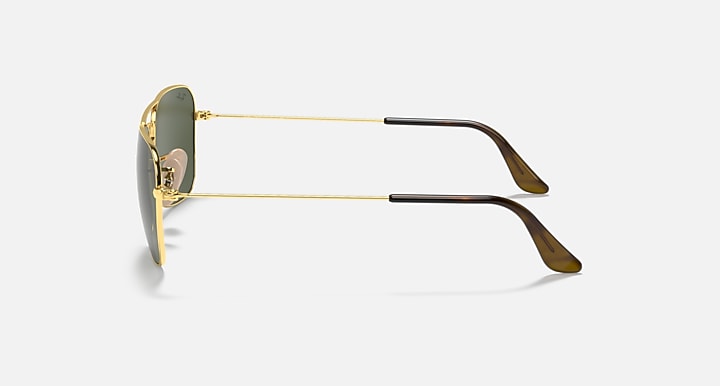 Gold metal sunglasses with dark green lens and black temple tips