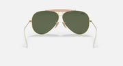 Ray-Ban aviator sunglasses with dark green lenses, gold frame, and pink top bar
