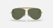 Ray-Ban aviator sunglasses with gold frame, dark green lenses, and pink bridge accent
